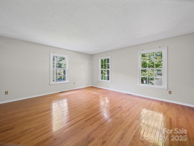 2020 Dawnshire Dr, Gastonia, NC 28054 - unfurnished room with light wood-style flooring and a textured ceiling