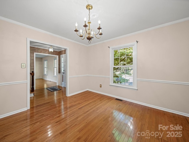 2020 Dawnshire Dr, Gastonia, NC 28054 - spare room with hardwood / wood-style floors, a chandelier, and ornamental molding