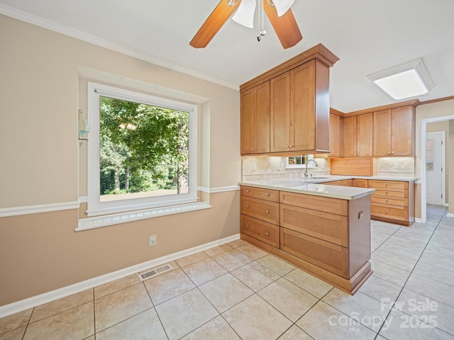 2020 Dawnshire Dr, Gastonia, NC 28054 - kitchen with light countertops, tasteful backsplash, light tile patterned floors, and crown molding