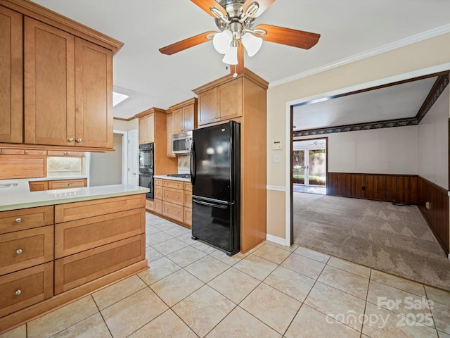 2020 Dawnshire Dr, Gastonia, NC 28054 - kitchen with black appliances, a ceiling fan, light tile patterned floors, light countertops, and wainscoting