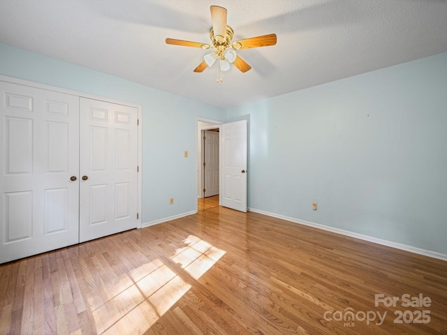 2020 Dawnshire Dr, Gastonia, NC 28054 - unfurnished bedroom featuring light wood-style floors, a closet, and a ceiling fan