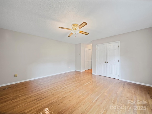 2020 Dawnshire Dr, Gastonia, NC 28054 - unfurnished bedroom with light wood-type flooring, two closets, and ceiling fan
