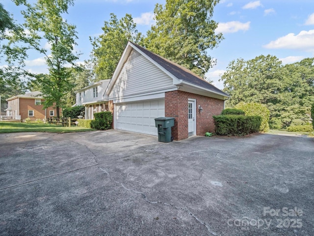 2020 Dawnshire Dr, Gastonia, NC 28054 - view of property exterior with brick siding, driveway, and an attached garage