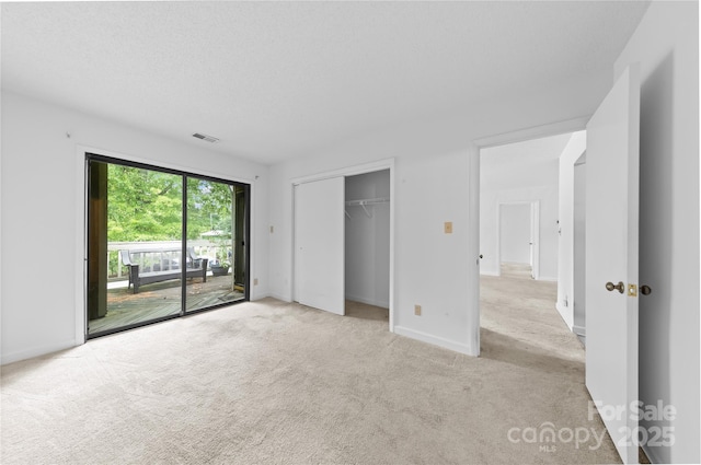 1604 Sharon Rd W Unit 30, Charlotte, NC 28210 - unfurnished bedroom with access to exterior, light carpet, and a closet