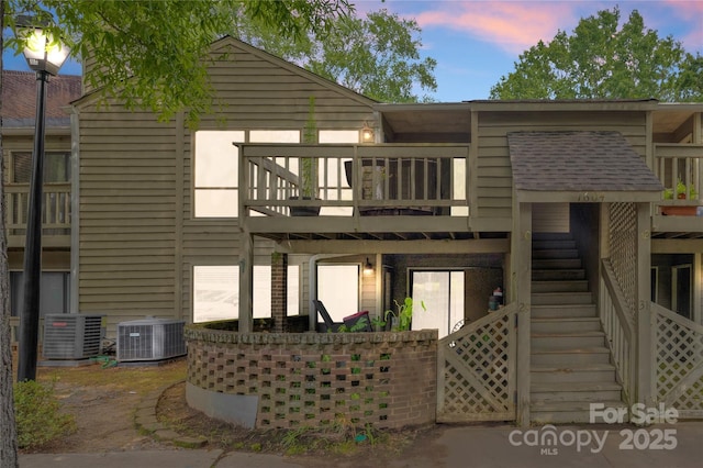1604 Sharon Rd W Unit 30, Charlotte, NC 28210 - back of house at dusk featuring stairway