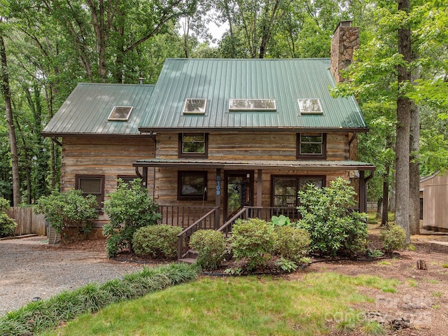 5109 Walnut Grove Ln, Charlotte, NC 28227 - view of front facade with a porch, a chimney, and a metal roof
