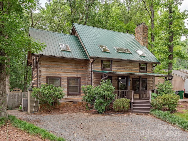 5109 Walnut Grove Ln, Charlotte, NC 28227 - view of front of home with a porch, a chimney, and a metal roof