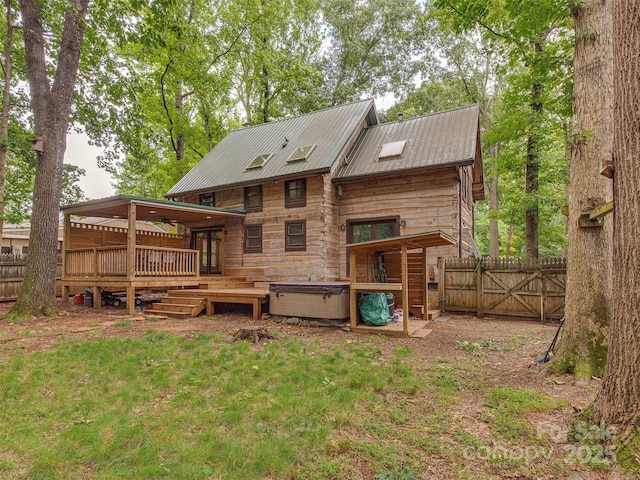 5109 Walnut Grove Ln, Charlotte, NC 28227 - rear view of house with a wooden deck, a gate, a hot tub, and a metal roof
