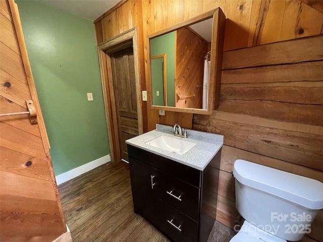 5109 Walnut Grove Ln, Charlotte, NC 28227 - bathroom featuring vanity, wood finished floors, and wooden walls