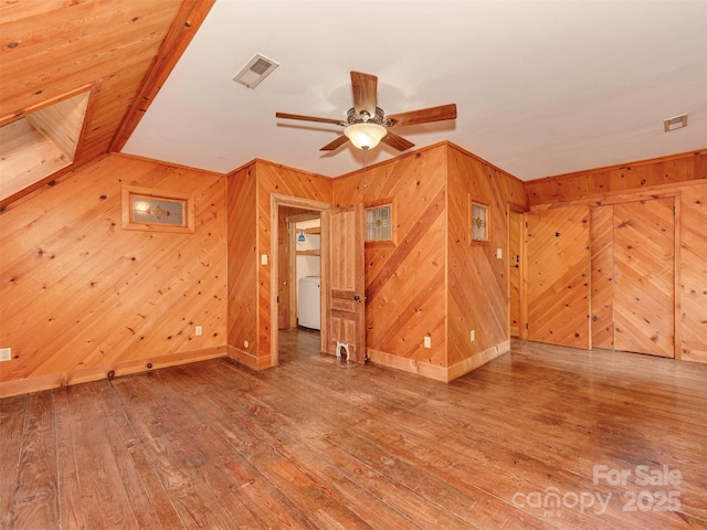 5109 Walnut Grove Ln, Charlotte, NC 28227 - unfurnished room featuring wooden walls, hardwood / wood-style floors, ceiling fan, and washer / clothes dryer