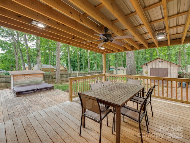 5109 Walnut Grove Ln, Charlotte, NC 28227 - deck with a shed, outdoor dining space, a fenced backyard, view of wooded area, and a ceiling fan