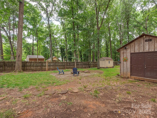 5109 Walnut Grove Ln, Charlotte, NC 28227 - fenced backyard with a shed and an outdoor fire pit