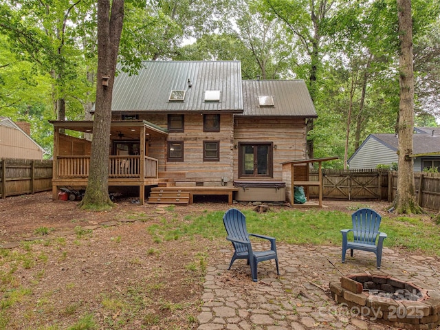 5109 Walnut Grove Ln, Charlotte, NC 28227 - rear view of house with an outdoor fire pit, a fenced backyard, a wooden deck, and a patio