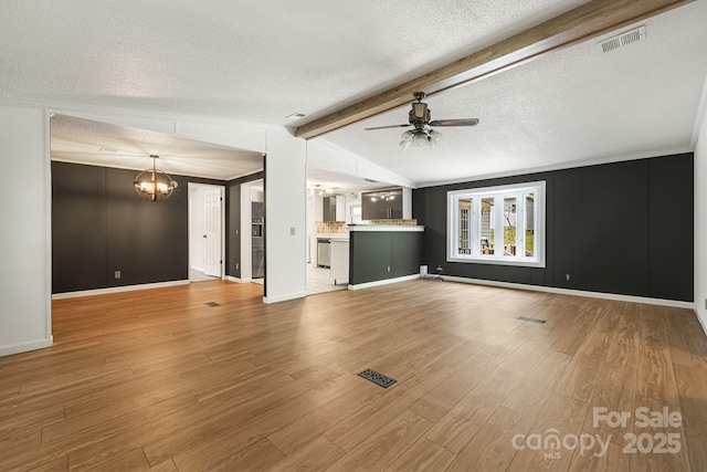 311 Flynn Br, Madison, NC 28753 - unfurnished living room featuring a textured ceiling, a chandelier, ceiling fan, and wood finished floors
