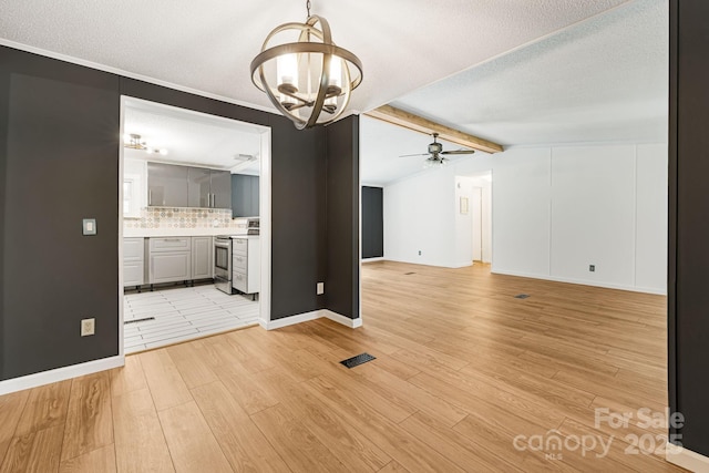 311 Flynn Br, Madison, NC 28753 - unfurnished living room featuring a chandelier, light wood-style floors, a textured ceiling, and ceiling fan