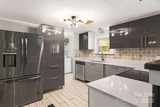 311 Flynn Br, Madison, NC 28753 - kitchen featuring refrigerator with ice dispenser, stainless steel dishwasher, washer / dryer, decorative backsplash, and a textured ceiling