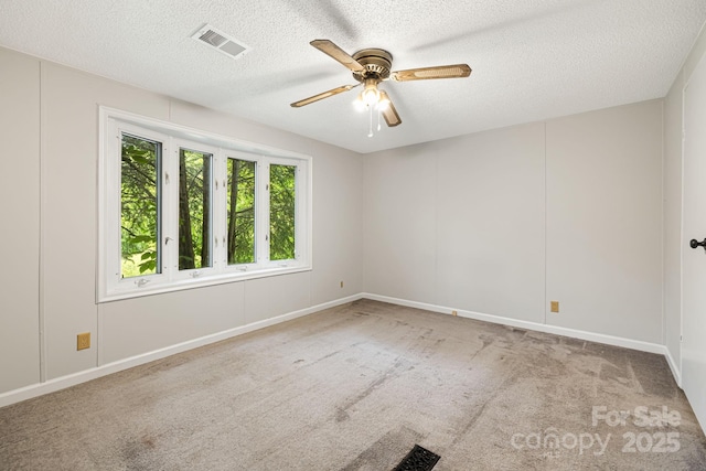 311 Flynn Br, Madison, NC 28753 - carpeted spare room featuring ceiling fan and a textured ceiling