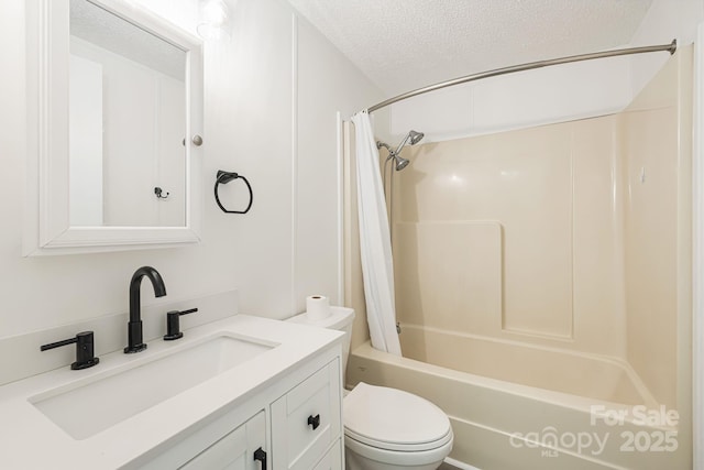 311 Flynn Br, Madison, NC 28753 - bathroom featuring a textured ceiling, vanity, and shower / tub combo