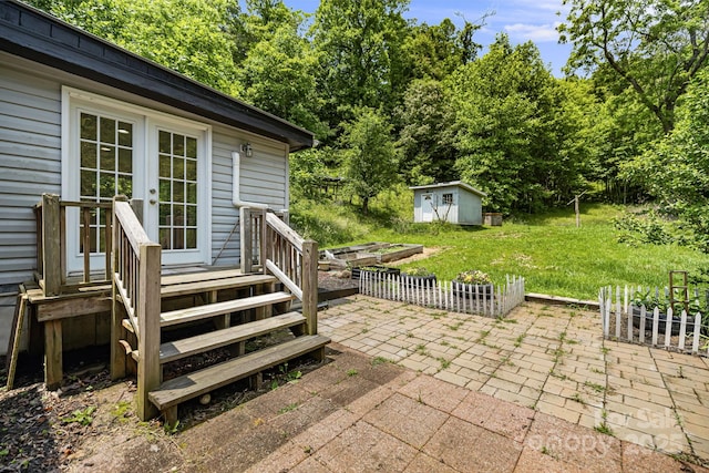 311 Flynn Br, Madison, NC 28753 - view of patio / terrace with french doors and a storage shed