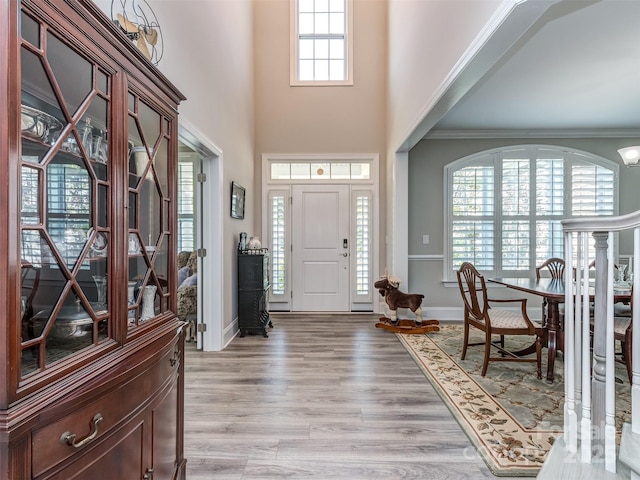 1011 Golden Bell Dr, Waxhaw, NC 28173 - entrance foyer with light wood finished floors and ornamental molding