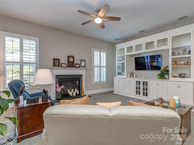 1011 Golden Bell Dr, Waxhaw, NC 28173 - living room featuring ceiling fan and a glass covered fireplace
