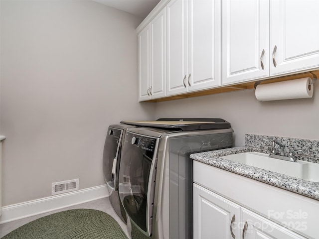 1011 Golden Bell Dr, Waxhaw, NC 28173 - washroom featuring cabinet space and washing machine and clothes dryer