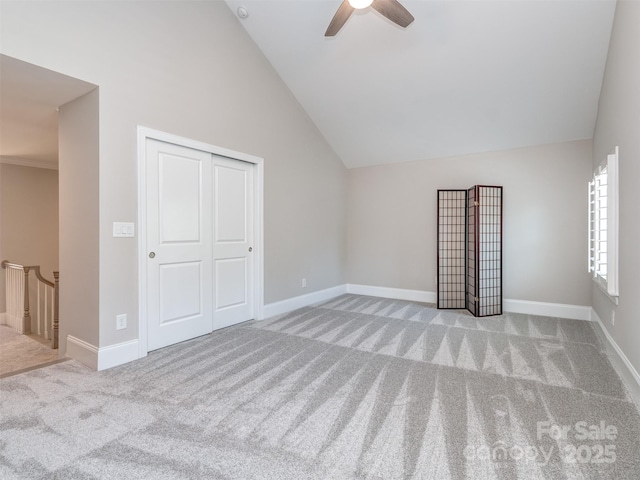 1011 Golden Bell Dr, Waxhaw, NC 28173 - unfurnished bedroom with carpet flooring, vaulted ceiling, a closet, and ceiling fan