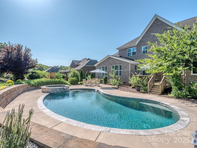 1011 Golden Bell Dr, Waxhaw, NC 28173 - view of pool with a wooden deck, a pool with connected hot tub, and a patio area