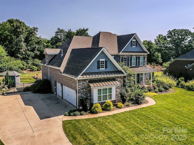 1011 Golden Bell Dr, Waxhaw, NC 28173 - view of front of home featuring a standing seam roof, a metal roof, driveway, stone siding, and a front yard