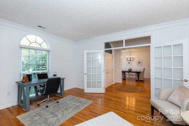 6507 Fairway Point Dr, Charlotte, NC 28269 - office area with crown molding, a chandelier, and wood finished floors