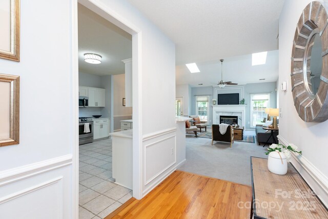 6507 Fairway Point Dr, Charlotte, NC 28269 - corridor with a skylight and light tile patterned flooring