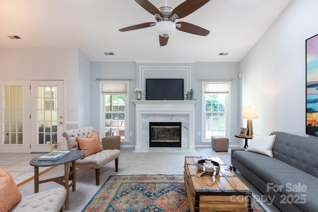 6507 Fairway Point Dr, Charlotte, NC 28269 - carpeted living area featuring plenty of natural light, a premium fireplace, and a ceiling fan