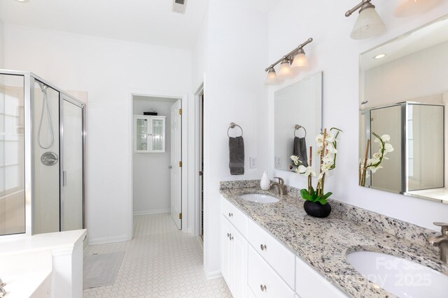 6507 Fairway Point Dr, Charlotte, NC 28269 - bathroom with double vanity, a shower stall, and a garden tub