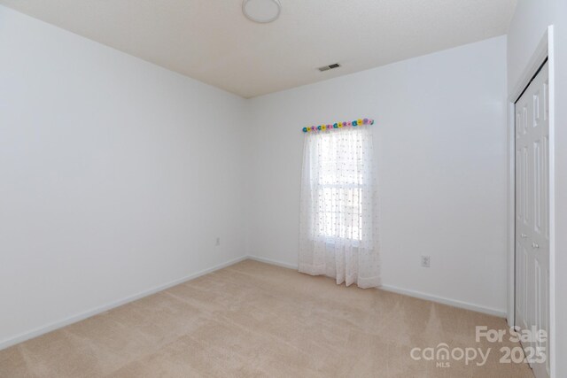 6507 Fairway Point Dr, Charlotte, NC 28269 - unfurnished bedroom with light colored carpet and a closet