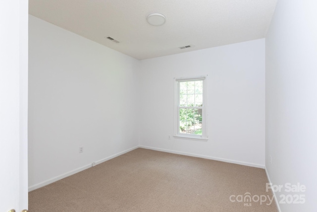 6507 Fairway Point Dr, Charlotte, NC 28269 - spare room featuring light colored carpet and baseboards