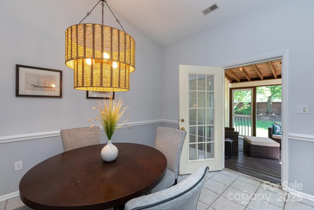 6507 Fairway Point Dr, Charlotte, NC 28269 - dining room featuring lofted ceiling and tile patterned floors