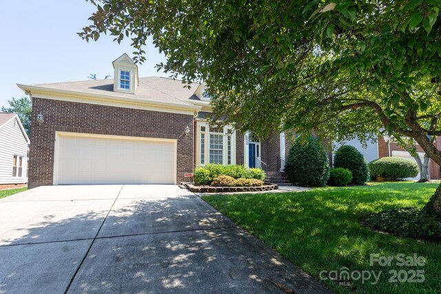 6507 Fairway Point Dr, Charlotte, NC 28269 - view of front of house featuring brick siding, concrete driveway, a garage, and a front lawn