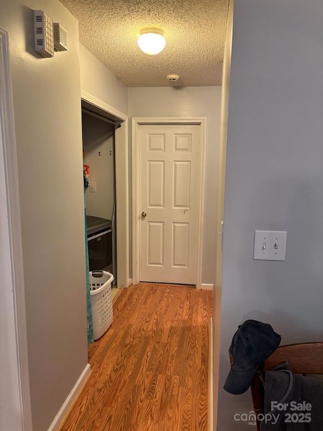 1920 Waldeck Ct, Mount Pleasant, NC 28124 - hallway with light wood-type flooring and a textured ceiling
