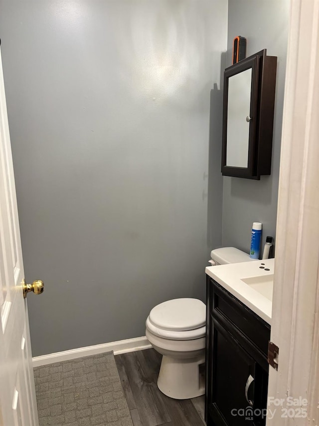1920 Waldeck Ct, Mount Pleasant, NC 28124 - half bathroom with vanity and wood finished floors