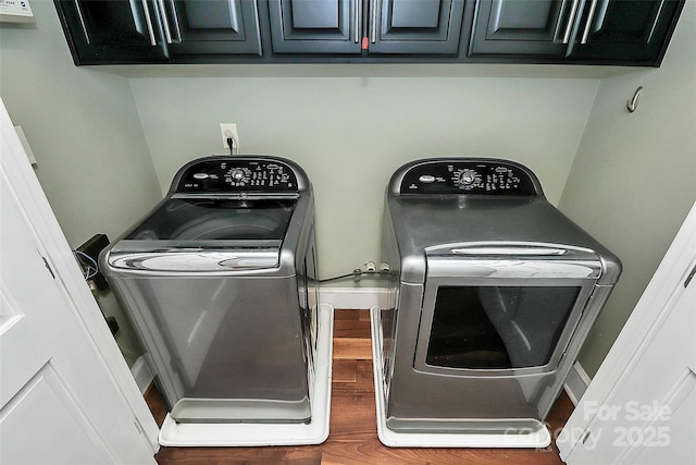 3730 Monique Ln, Charlotte, NC 28210 - laundry room with washing machine and clothes dryer, wood finished floors, and cabinet space