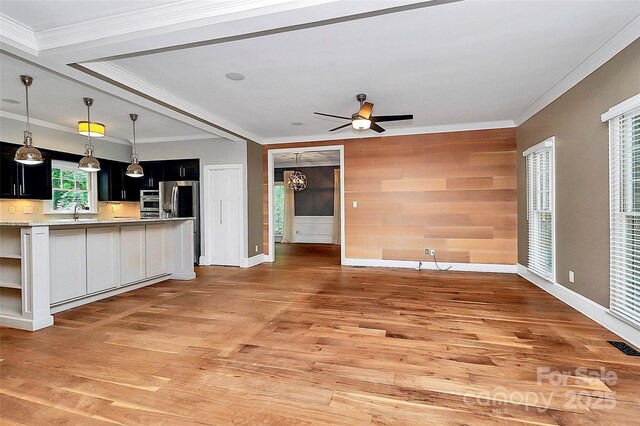3730 Monique Ln, Charlotte, NC 28210 - kitchen with light wood-style floors, open shelves, light countertops, ceiling fan, and open floor plan