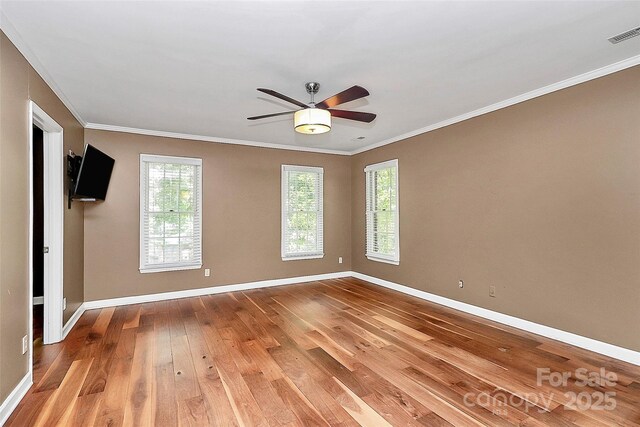 3730 Monique Ln, Charlotte, NC 28210 - empty room featuring hardwood / wood-style floors, a ceiling fan, and crown molding