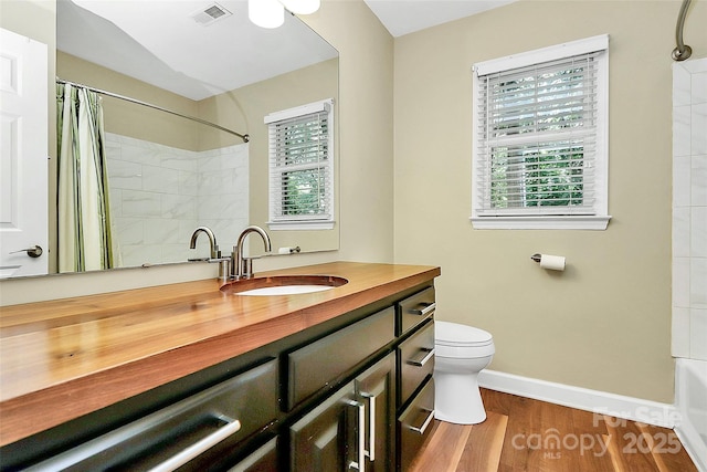 3730 Monique Ln, Charlotte, NC 28210 - full bath with vanity, wood finished floors, and shower / tub combo