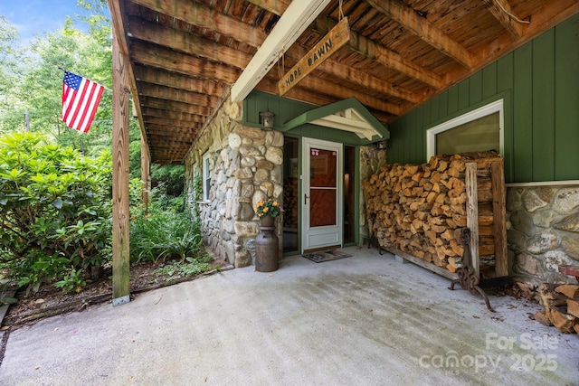13884 Cruso Rd, Canton, NC 28716 - property entrance featuring stone siding, board and batten siding, and a patio
