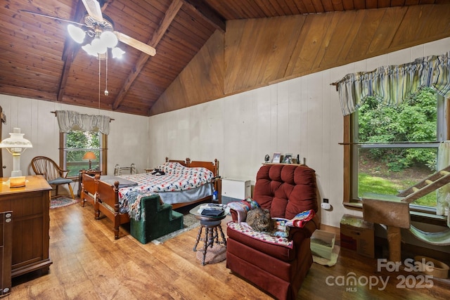 13884 Cruso Rd, Canton, NC 28716 - bedroom with light wood finished floors, a wooden ceiling with exposed beams, wooden walls, and high vaulted ceiling