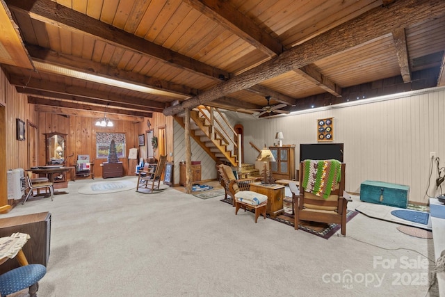 13884 Cruso Rd, Canton, NC 28716 - living room with wood walls, a wood ceiling with exposed beams, stairs, carpet floors, and ceiling fan