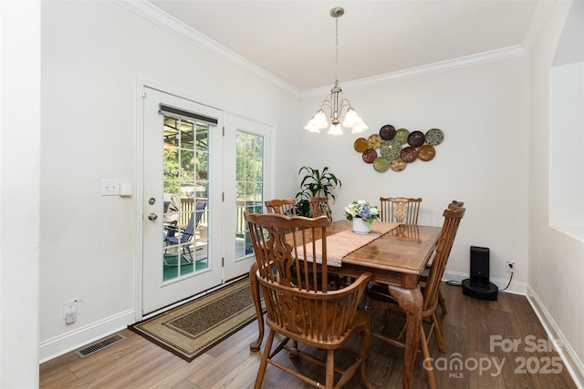 1593 Bloomfield Rd, Rock Hill, SC 29732 - dining space featuring crown molding, wood finished floors, and a chandelier