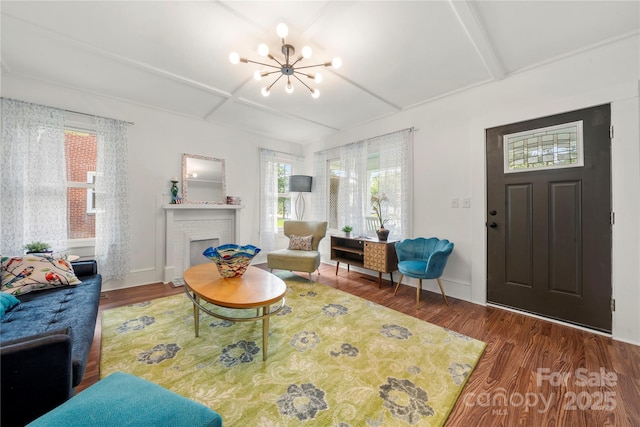 124 Marion St, Clover, SC 29710 - living area with a chandelier, wood finished floors, healthy amount of natural light, a brick fireplace, and beamed ceiling