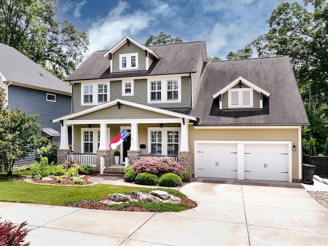 612 Ideal Way, Charlotte, NC 28203 - craftsman-style home featuring a porch, concrete driveway, ceiling fan, roof with shingles, and an attached garage