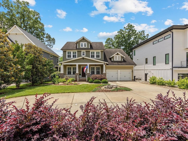612 Ideal Way, Charlotte, NC 28203 - view of front of house featuring a porch, concrete driveway, a garage, and a front yard